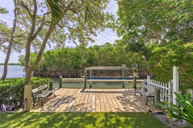 wooden terrace featuring a dock and a water view