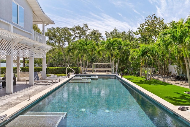 view of swimming pool featuring a pergola and a patio area