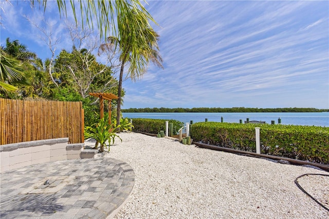 view of patio featuring a water view