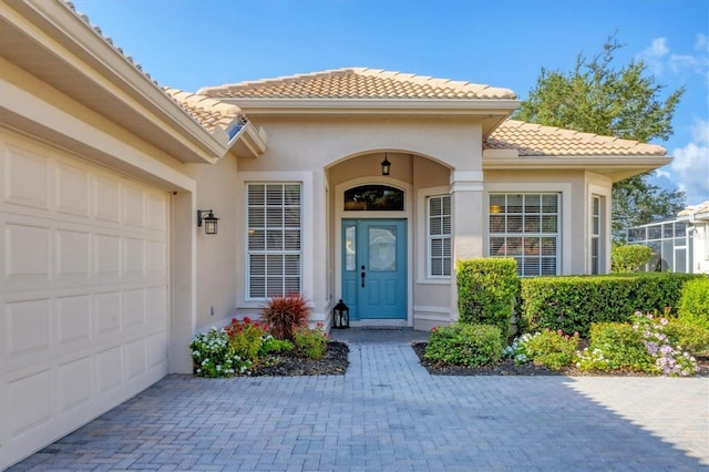 doorway to property featuring a garage