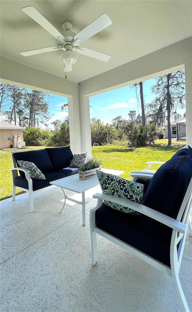 view of patio featuring ceiling fan and outdoor lounge area