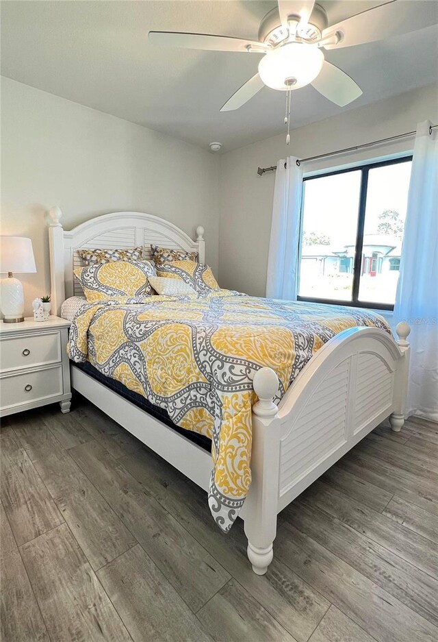 bedroom featuring ceiling fan and wood-type flooring