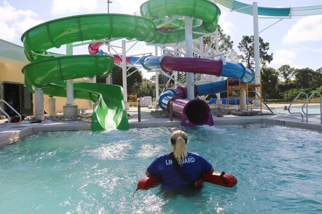 view of swimming pool featuring a water slide