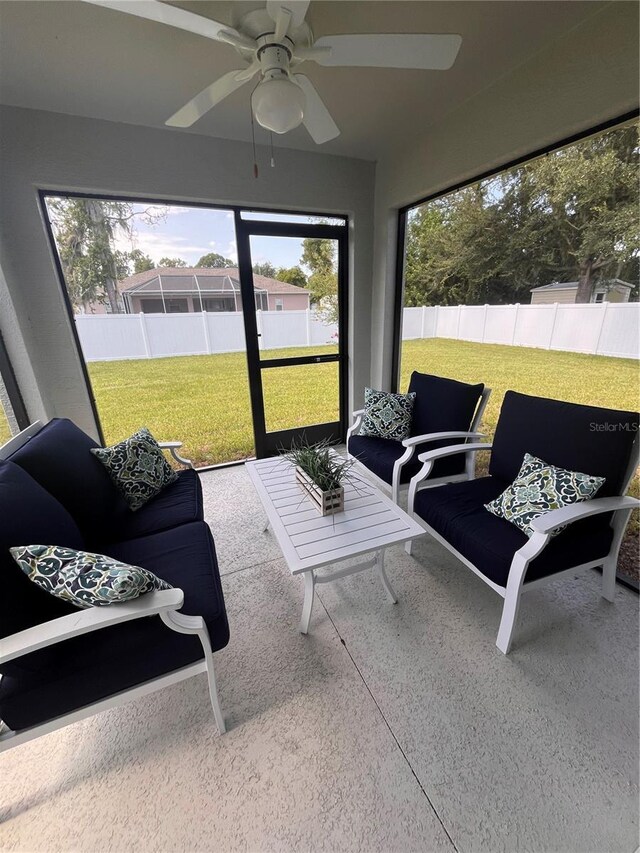 sunroom / solarium with ceiling fan