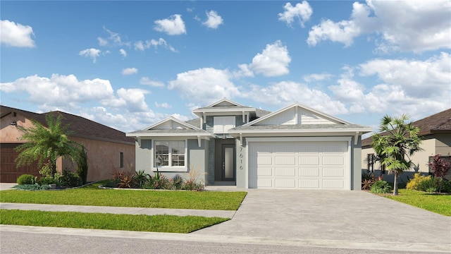 view of front of home with a front yard and a garage