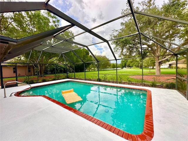 view of swimming pool with a patio and a lanai