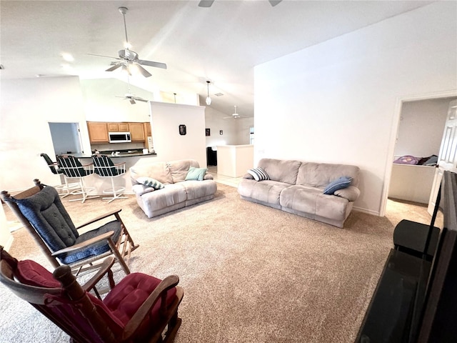 carpeted living room with high vaulted ceiling and ceiling fan