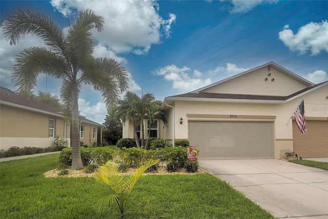 ranch-style home with a garage and a front yard