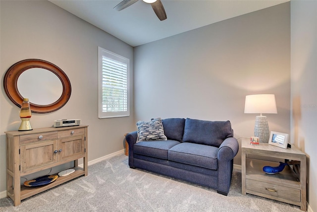 living room featuring ceiling fan and light carpet