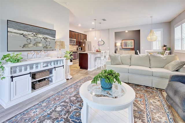 living room featuring light wood-type flooring