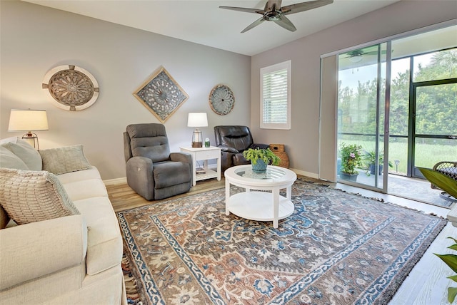 living room with hardwood / wood-style floors and ceiling fan