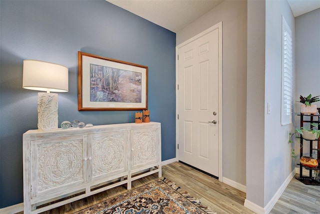 8930 Tuscany Isles Dr, Punta Gorda, FL 33950 - entryway featuring wood finished floors and baseboards