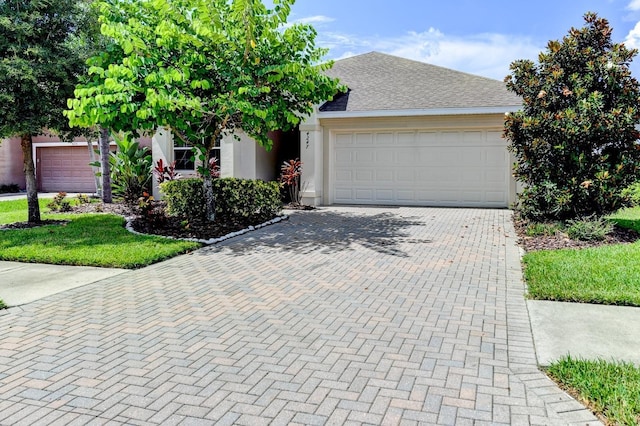 view of front of property with a garage