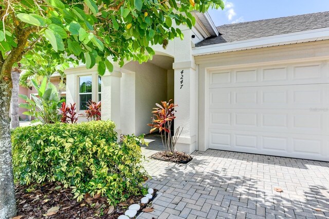 property entrance with a garage