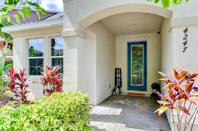 doorway to property with a patio