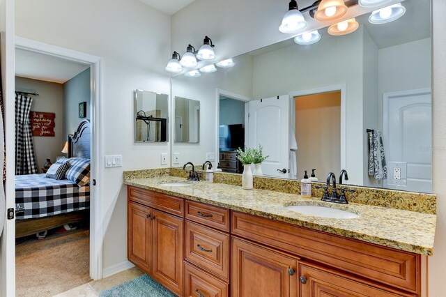 bathroom featuring tile patterned floors and double sink vanity