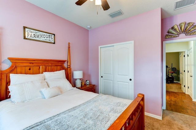 carpeted bedroom with a closet and ceiling fan