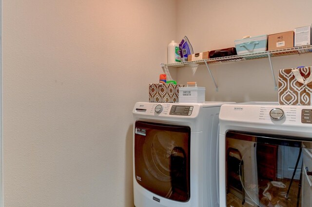 laundry room featuring separate washer and dryer