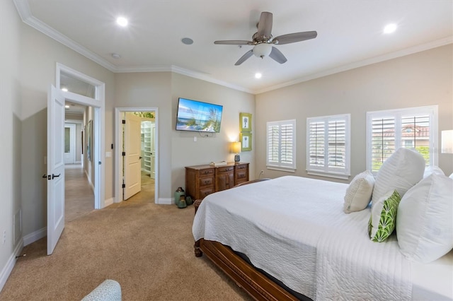 carpeted bedroom featuring ceiling fan and crown molding