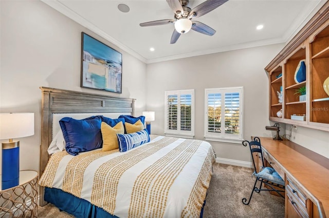 carpeted bedroom featuring ceiling fan and ornamental molding