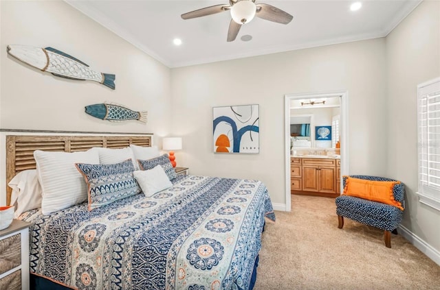 bedroom with ceiling fan, ensuite bathroom, light colored carpet, and ornamental molding