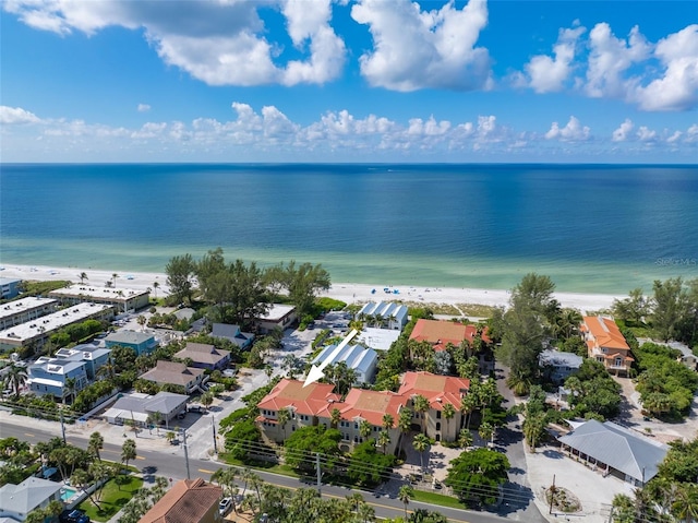 drone / aerial view featuring a water view and a view of the beach