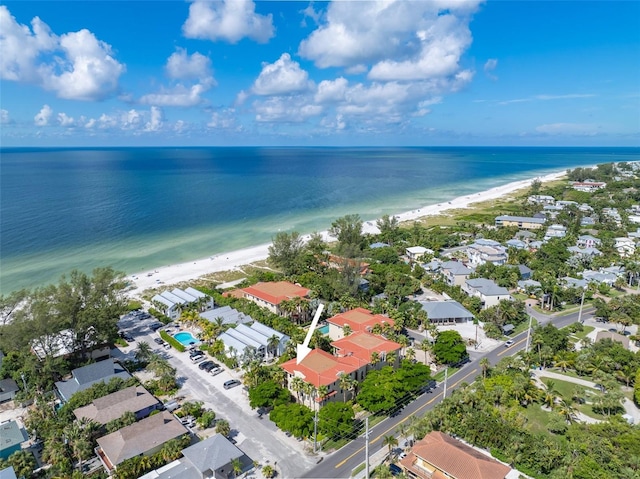 drone / aerial view with a beach view and a water view