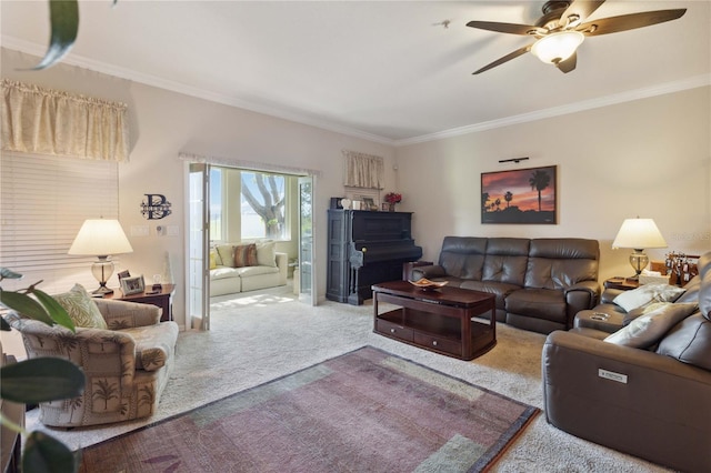 carpeted living room featuring crown molding and ceiling fan