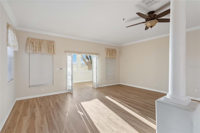 interior space featuring visible vents, light wood finished floors, crown molding, and ornate columns