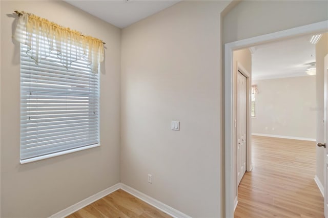 interior space with light wood-style flooring and baseboards