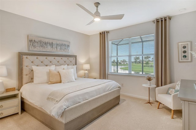 bedroom featuring light colored carpet and ceiling fan