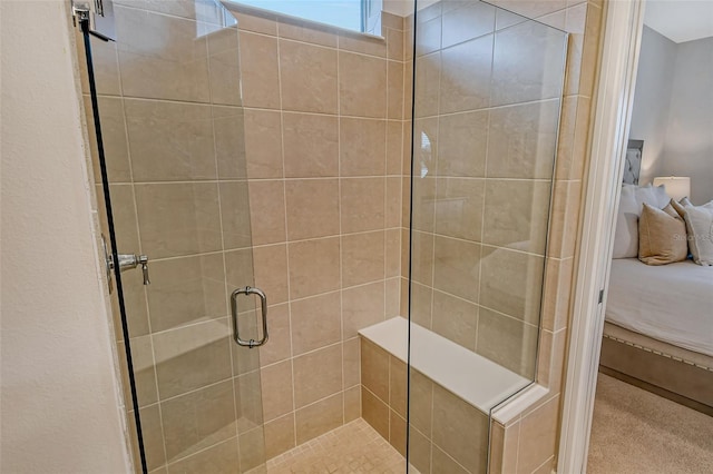 bathroom with a shower with shower door