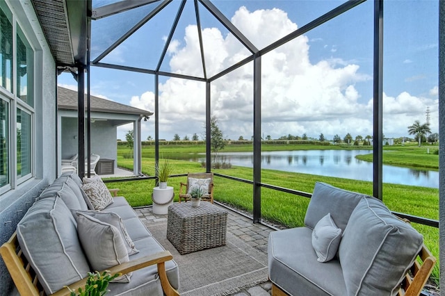 sunroom with a water view and a wealth of natural light