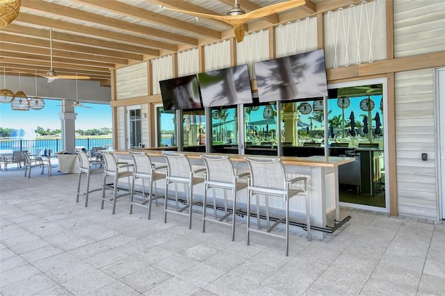 view of patio featuring an outdoor bar