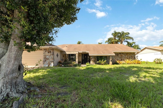 single story home featuring a front yard