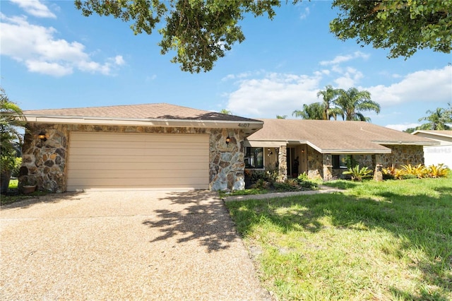 ranch-style home with a front yard and a garage