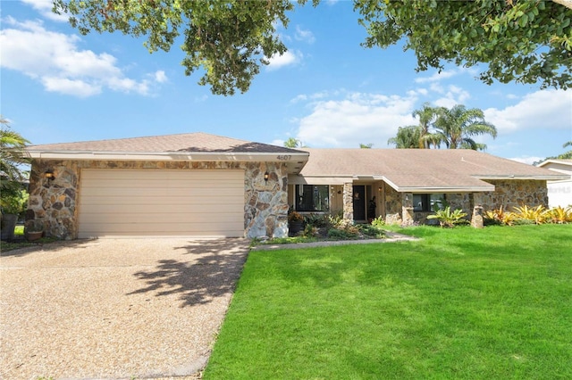 ranch-style home with a garage and a front lawn