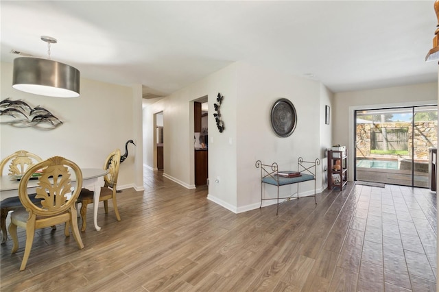 dining room with hardwood / wood-style floors