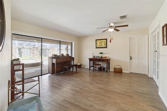 interior space featuring hardwood / wood-style floors and ceiling fan