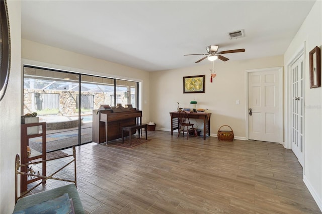 entrance foyer with dark hardwood / wood-style flooring and ceiling fan