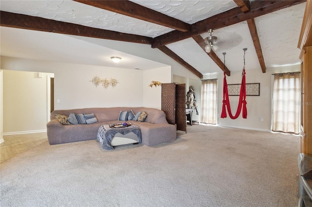 living room with carpet flooring, ceiling fan, and plenty of natural light