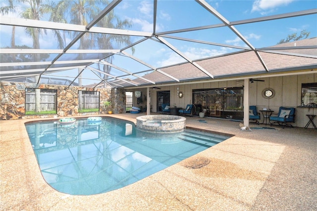 view of pool with ceiling fan, a lanai, an in ground hot tub, and a patio