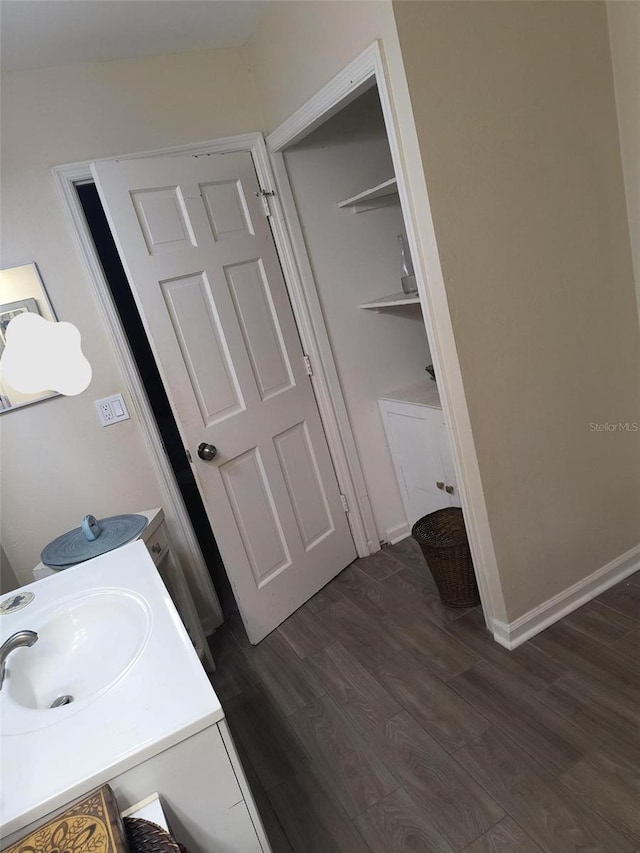 bathroom with vanity and wood-type flooring