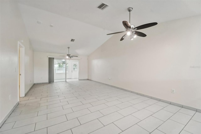 tiled spare room featuring vaulted ceiling and ceiling fan