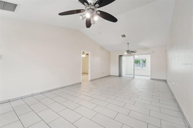 tiled spare room featuring ceiling fan and lofted ceiling