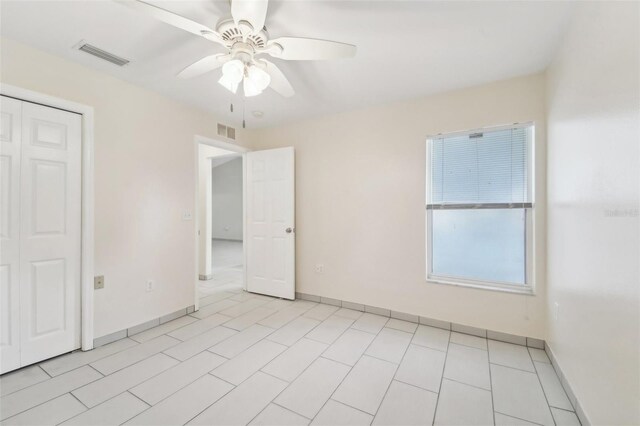 unfurnished room featuring ceiling fan