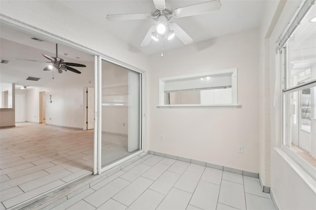 unfurnished room with ceiling fan