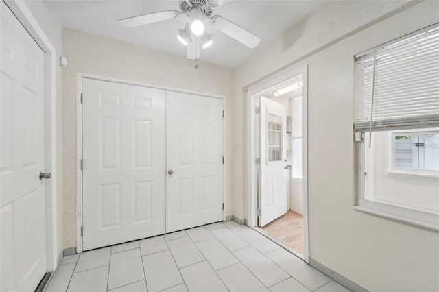 interior space with light tile patterned floors and a healthy amount of sunlight