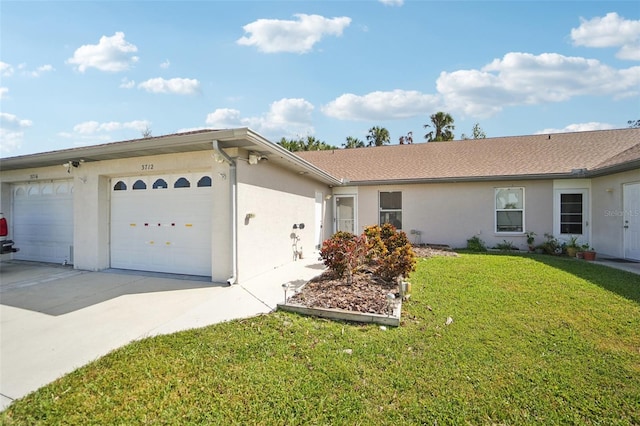 ranch-style house featuring a front yard and a garage