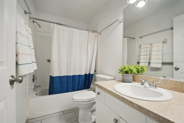 full bathroom featuring tile patterned floors, shower / tub combo with curtain, vanity, and toilet